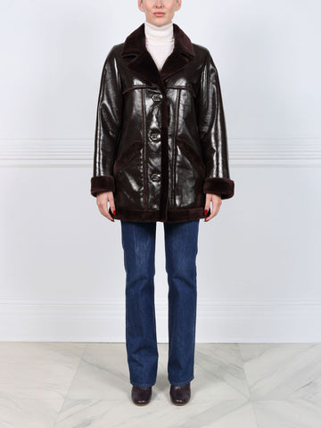 The Vermilion Patent Shearling Coat