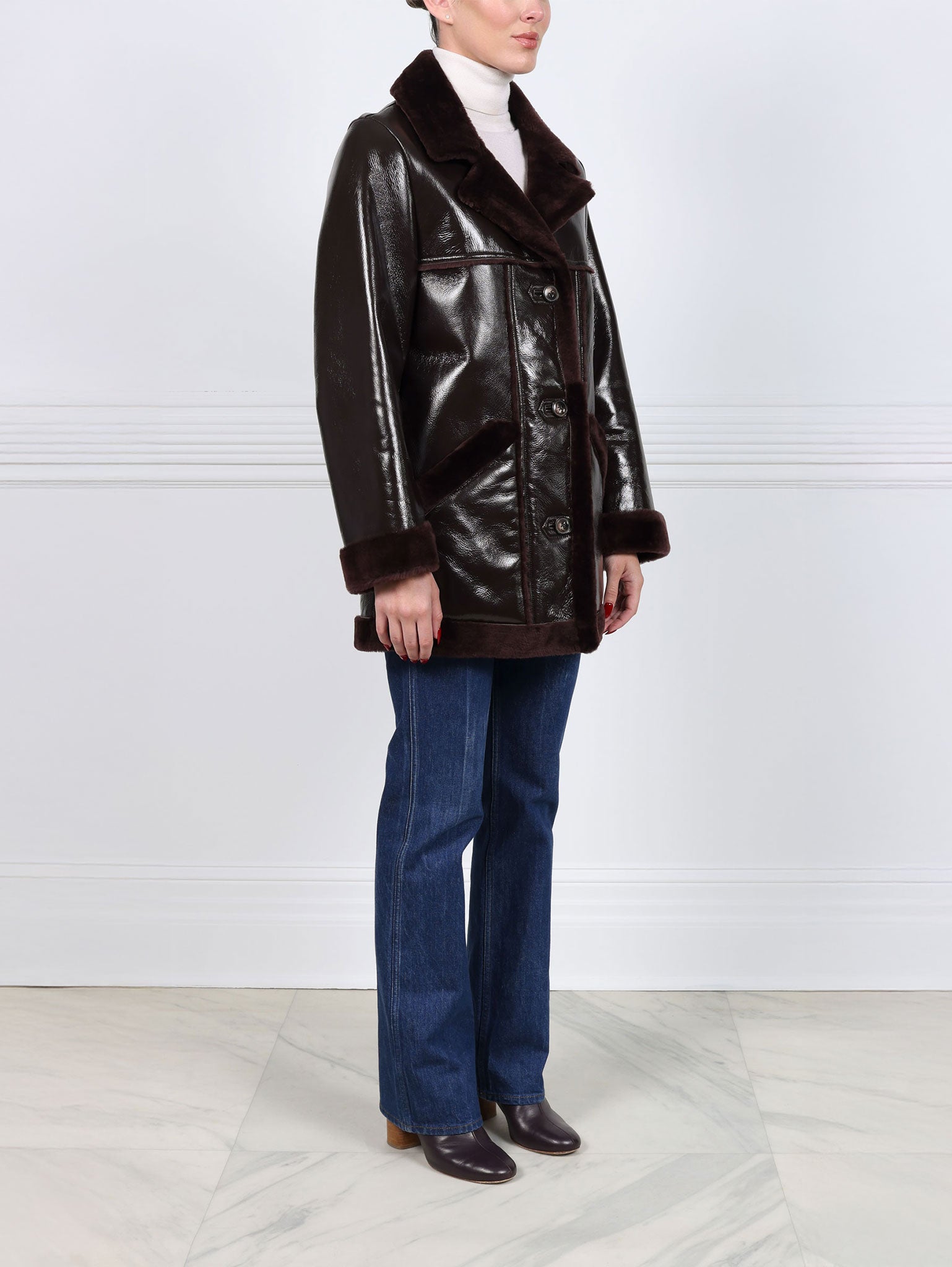 The Vermilion Patent Shearling Coat