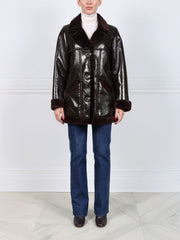 The Vermilion Patent Shearling Coat
