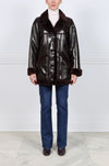 The Vermilion Patent Shearling Coat