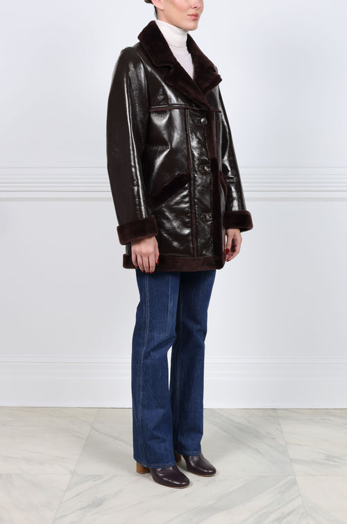 The Vermilion Patent Shearling Coat