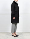 SIDE VIEW-BLACK SHEARLING BALMACAAN COAT-FUR SHIRT COLLAR-STRAIGHT FULL LENGTH SLEEVES WITH BUTTON TABS-FUR TRIMMED PATCH POCKETS, TUXEDO AND SLEEVE ENDS-BUTTON CLOSURES-38 INCH CENTER BACK LENGTH-BY POLOGEORGIS