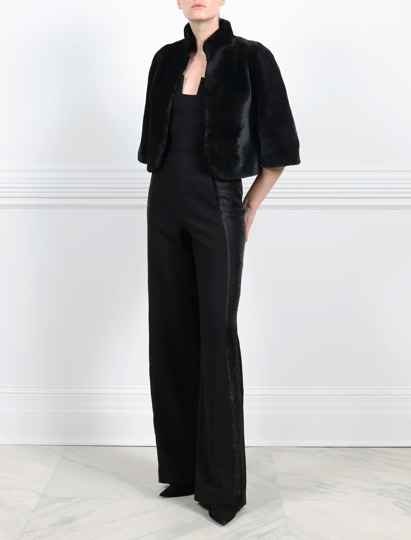 ACTION VIEW-BLACK SHEARLING JACKET-ROUNDED STAND COLLAR-THREE QUARTER LENGTH SLEEVES-HOOK AND EYE CLOSURES-19 INCH CENTER BACK LENGTH-BY POLOGEORGIS