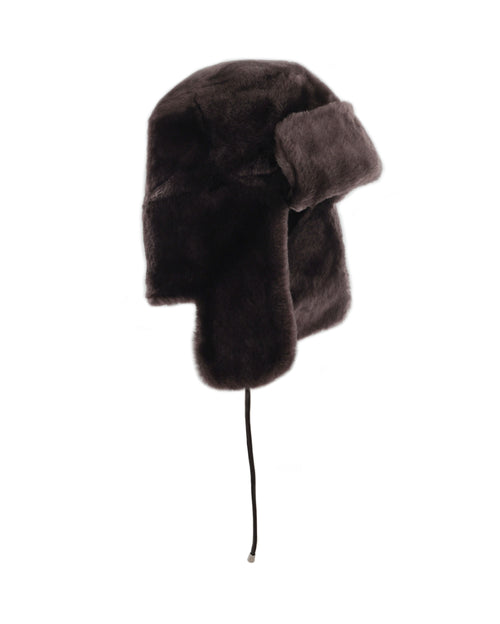 dark brown shearling trapper hat with leather ties & gunmetal stoppers
