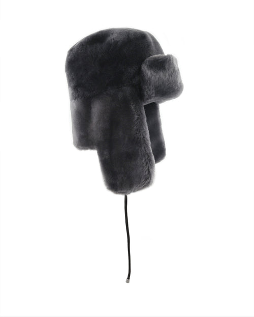 DARK GREY SHEARLING TRAPPER HAT WITH LEATHER TIES & GUNMETAL STOPPERS BY POLOGEORGIS