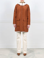 FRONT VIEW TECHNO SIDE-IVORY SHEARLING ANORAK REVERSIBLE TO CONTRASTING COCO TECHNO FABRIC-HOODED-FULL LENGTH SLEEVES-FLAP POCKETS-HIDDEN FRONT SNAPS OVER ZIPPER CLOSURE-31 INCH CENTER BACK LENGTH-BY POLOGEORGIS