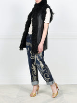 KNITTED FLOWER PRINTED ON BLACK REVERSIBLE SHEARLING VEST DESIGNED BY ZANDRA RHODES FOR POLOGEORGIS-STAND COLLAR-SLIT POCKETS-SNAP CLOSURES-CURLY SHEARLING TRIM AT ARMHOLES AND TUXEDO-30 INCH CENTER BACK LENGTH
