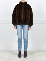 FRONT VIEW-MAHOGANY MINK BOMBER JACKET-STAND COLLAR-FULL LENGTH SLEEVES-SLIT POCKETS-FRONT ZIP CLOSURE-GATHERED LEATHER TRIM AT WRISTS AND WAIST -25 INCH CENTER BACK LENGTH-BY POLOGEORGIS
