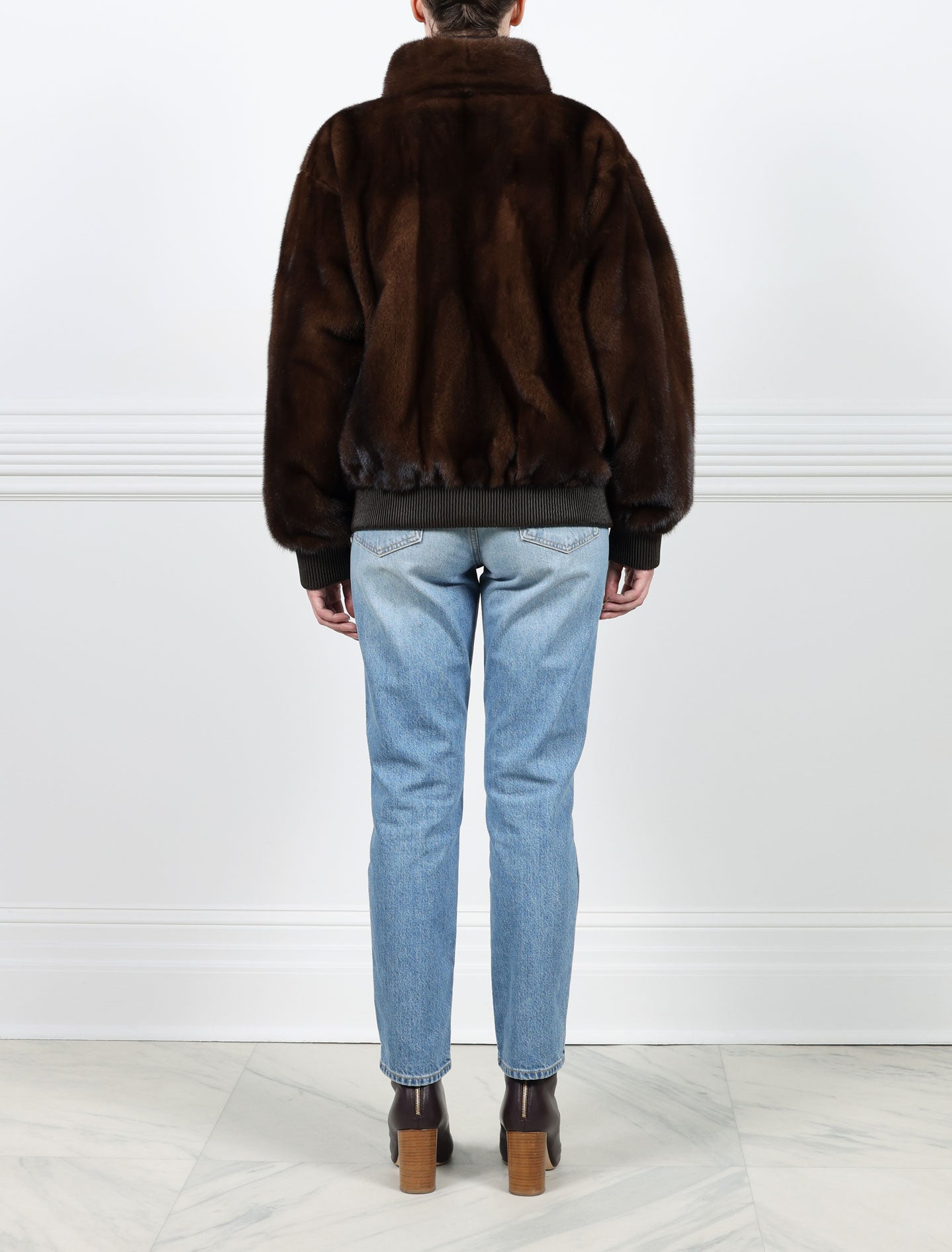 BACK VIEW-MAHOGANY MINK BOMBER JACKET-STAND COLLAR-FULL LENGTH SLEEVES-SLIT POCKETS-FRONT ZIP CLOSURE-GATHERED LEATHER TRIM AT WRISTS AND WAIST -25 INCH CENTER BACK LENGTH-BY POLOGEORGIS