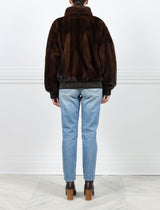 BACK VIEW-MAHOGANY MINK BOMBER JACKET-STAND COLLAR-FULL LENGTH SLEEVES-SLIT POCKETS-FRONT ZIP CLOSURE-GATHERED LEATHER TRIM AT WRISTS AND WAIST -25 INCH CENTER BACK LENGTH-BY POLOGEORGIS