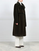 SIDE VIEW-DYED PAULINE GREEN MINK COAT-NOTCH COLLAR-FULL LENGTH SLEEVES-SLIT POCKETS-HOOK AND EYE CLOSURES-COUBLE FUR BELT-45 INCH CENTER BACK LENGTH-BY POLOGEORGIS