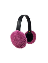 PINK CURLY SHEARLING EARMUFFS WITH LEATHER BAND BY POLOGEORGIS