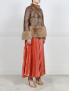 SIDE VIEW-PRINTED SHEARLING JACKET WITH FUR PEPLUM AND CUFFS DESIGNED BY ZANDRA RHODES FOR POLOGEORGIS- FUR STAND COLLAR-STRAIGHT SLEEVES WITH FUR SLEEVE ENDS-SNAP CLOSURES-24 INCH CENTER BACK LENGTH- PRINTED FANTASTIC FLOWERS DESIGN ON BROWN SHEARLING
