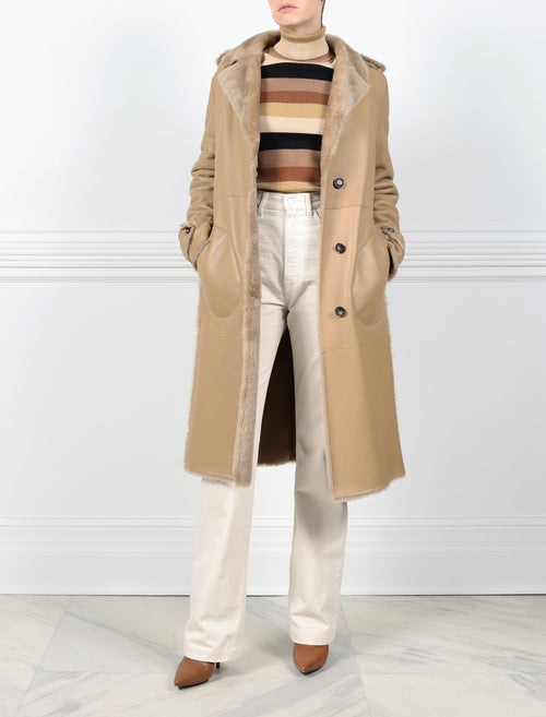 ACTION VIEW-TAN SHEARLING TRENCH COAT-NOTCH COLLAR-FULL LENGTH SLEEVES WITH BUTTON TABS-SLIT POCKETS-LEATHER BELT-42 INCH CENTER BACK LENGTH- BY POLOGEORGIS