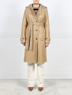 FRONT VIEW-TAN SHEARLING TRENCH COAT-NOTCH COLLAR-FULL LENGTH SLEEVES WITH BUTTON TABS-SLIT POCKETS-LEATHER BELT-42 INCH CENTER BACK LENGTH- BY POLOGEORGIS