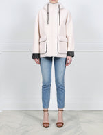 FRONT VIEW-IVORY HOODED BOMBER JACKET WITH BLACK LEATHER TRIM-DRAWSTRING HOOD  WITH METAL STOPPERS-FULL LENGTH SLEEVES WITH BLACK LEATHER CUFFS-BLACK LEATHER TRIMMED FLAP POCKETS-HIDDEN ZIP CLOSURE-28 INCH CENTER BACK LENGTH-BY POLOGEORGIS